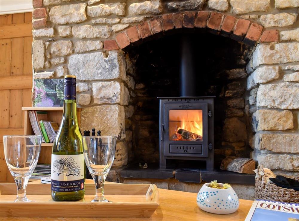 Cosy living/dining room with wood burner at Farview in Selsley, near Stroud, Gloucestershire