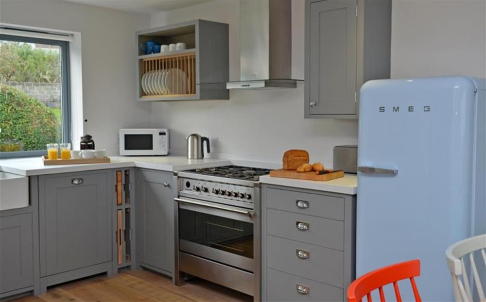 The modern and well equipped kitchen at Fastnet in Salcombe