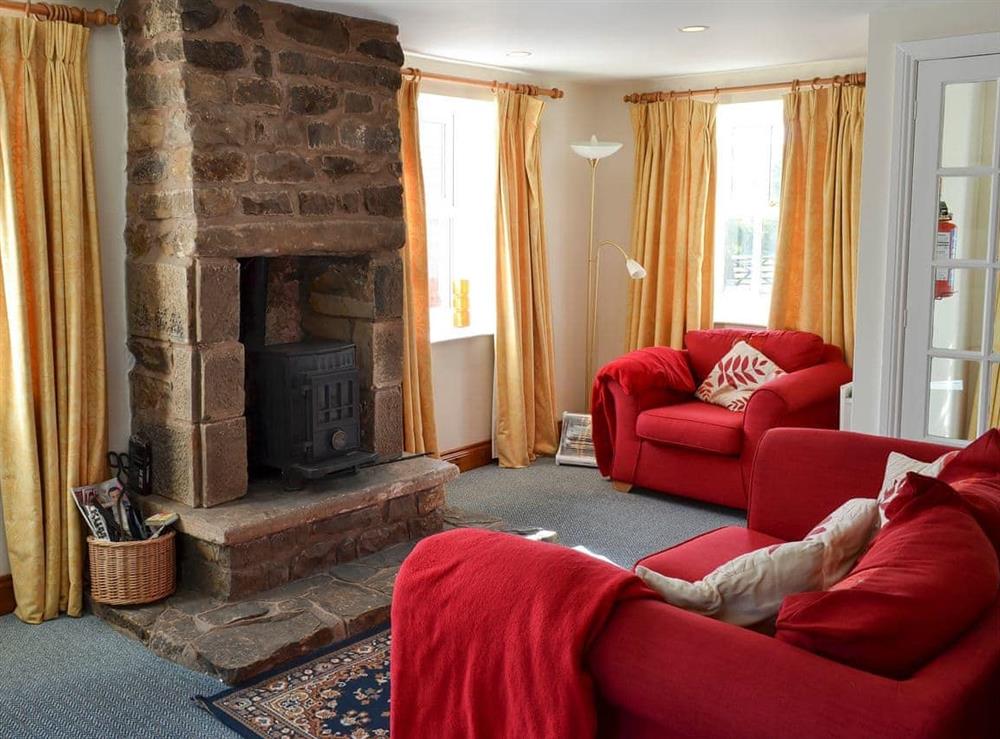Cosy living area with wood burner at Felbridge Cottage in Bardon Mill, near Hexham, Northumberland
