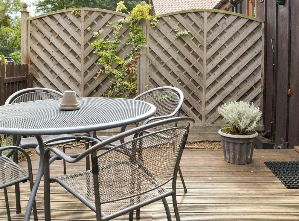 Enclosed patio area with outdoor furniture at Felgate in Norwich, Norfolk