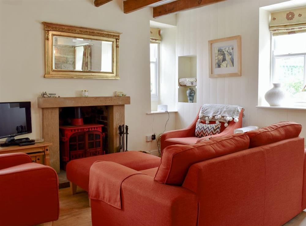 Comfortable living area with wood burner at Felicity House in Staithes, near Whitby, North Yorkshire