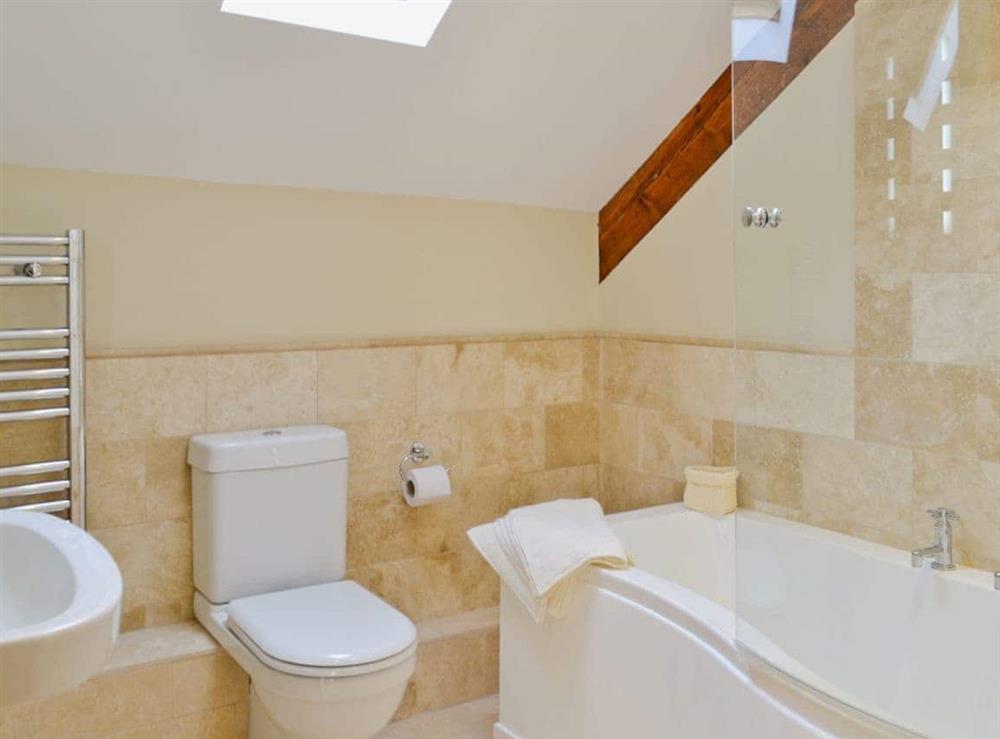 Modern bathroom with shower over the bath at Felin Hedd in Tregaron, near Aberystwyth, Dyfed