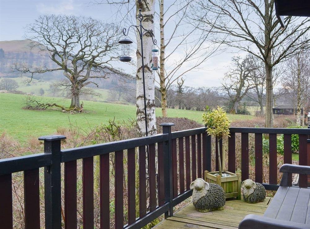 Decked terrace with outdoor furniture at Fell Foot Lodge in Keswick, Cumbria