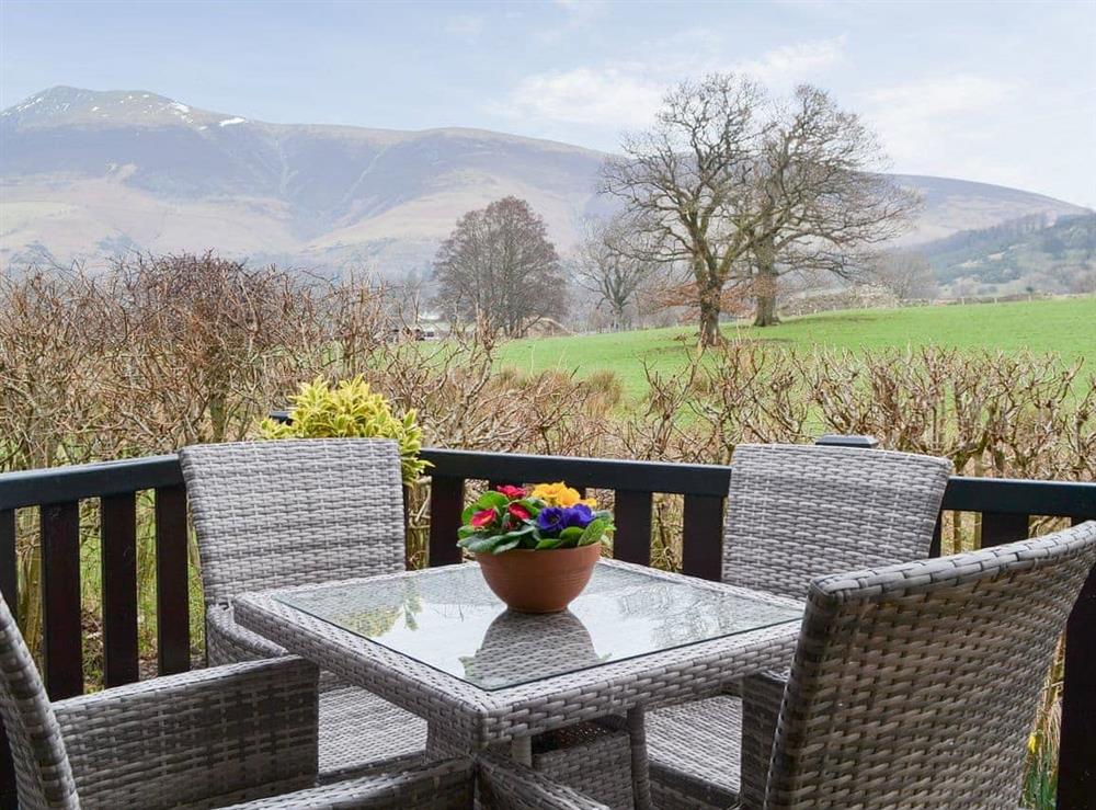 Relax on the terrace and take in the Lakeland views at Fell Foot Lodge in Keswick, Cumbria