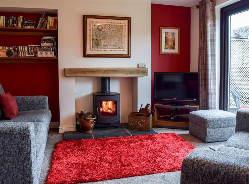 Tastefully furnished living room with patio doors at Fell View in Skipton, North Yorkshire