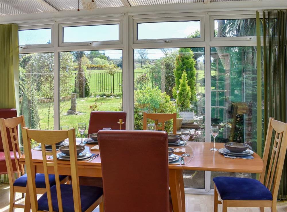 Idela dining area in the conservatory at Fellview in Brodick, Isle Of Arran