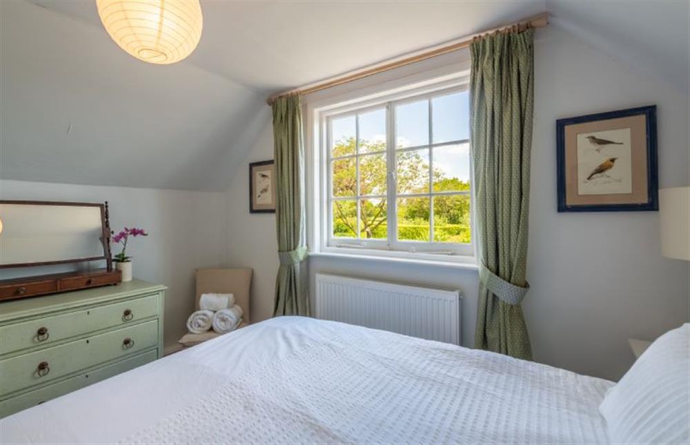 Bedroom with views to the rear of the cottage at Fenwick Cottage, Higham