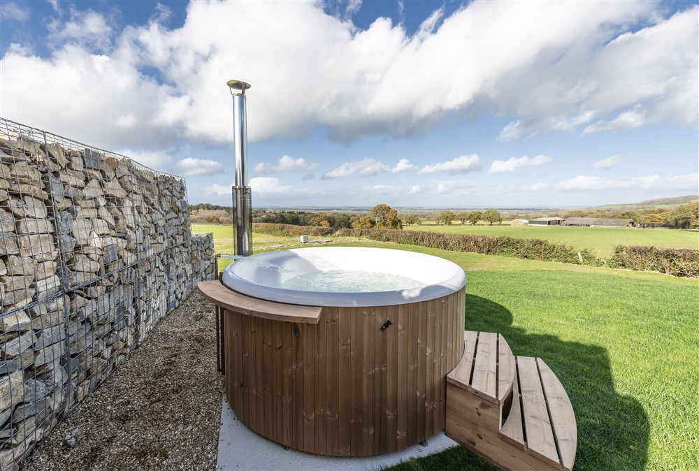 The Skarsgard hot tub and rural views beyond at Fern, Ansty, Dorchester