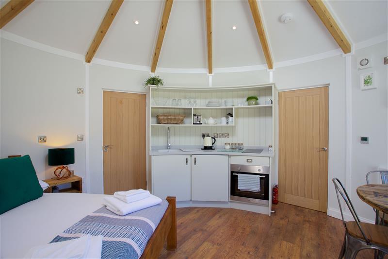 Double bedroom and living area at Fern Leaf Roundhouse - East Thorne, Bude, Cornwall