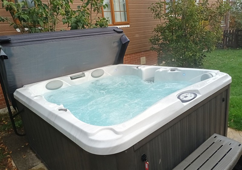 Relax in the hot tub at Fern Lodge, Stonham Aspal