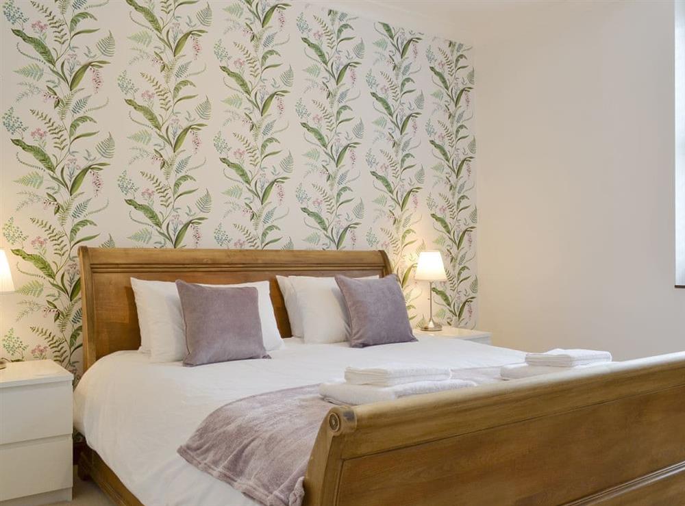 Peaceful super kingsize bedroom with en-suite shower room at Fern Spree in Buxton, Derbyshire