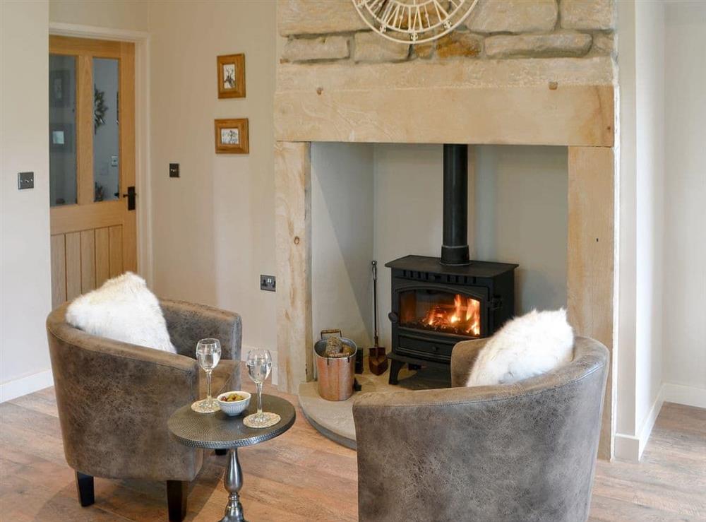 Cosy wood burner in the kitchen/dining are at Ferncliffe Cottage in Thropton, near Morpeth, Northumbria, Northumberland