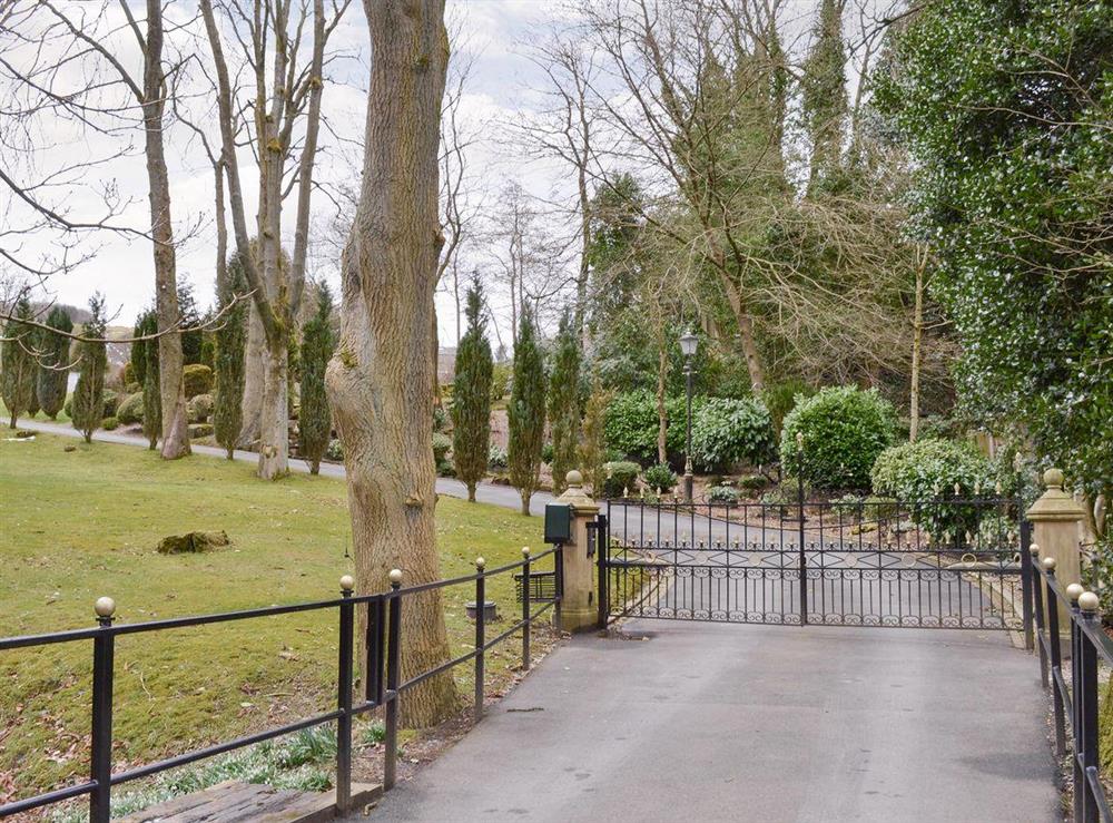 Tree-lined gated entrance at Fernhill Cottage in Oxenhope, near Haworth, West Yorkshire