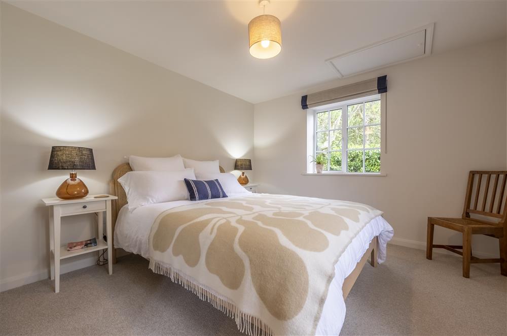 Bedroom two with a 5’ king-size bed at Fernwood, Rolvenden
