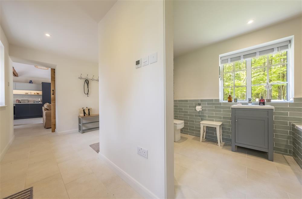 The entrance hallway leads to the family bathroom and bedroom one at Fernwood, Rolvenden