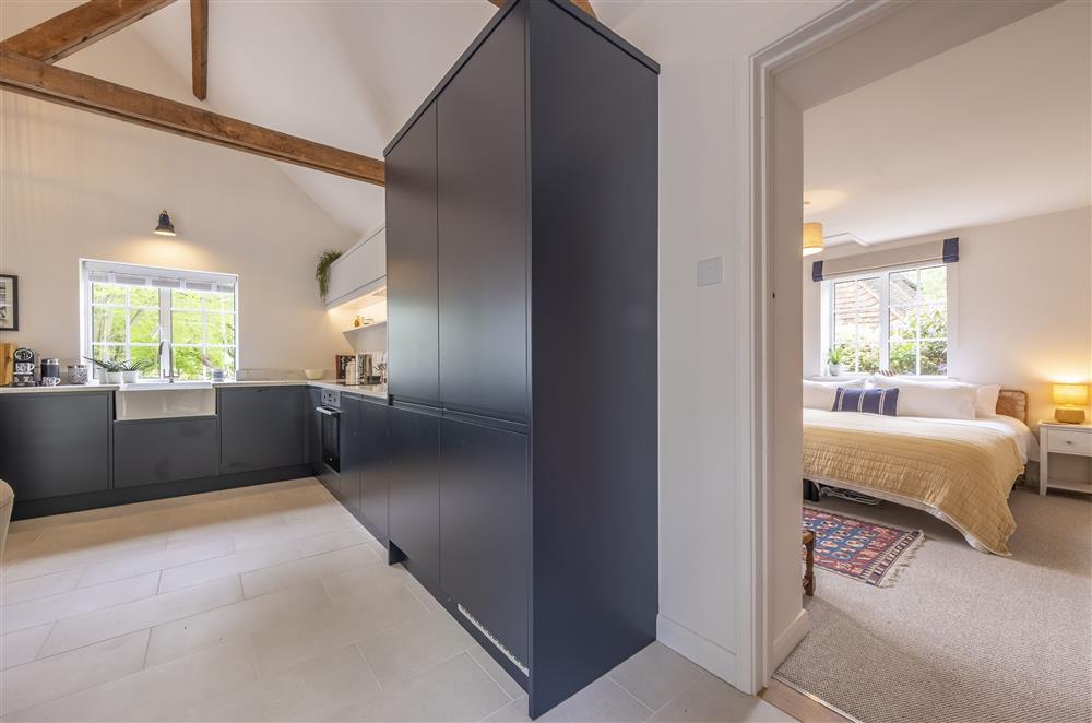 The open-plan living area leads off to bedroom two at Fernwood, Rolvenden