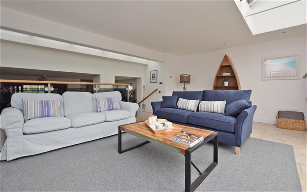 Light and airy living area with comfortable sofas at Ferry Cottage in Lymington