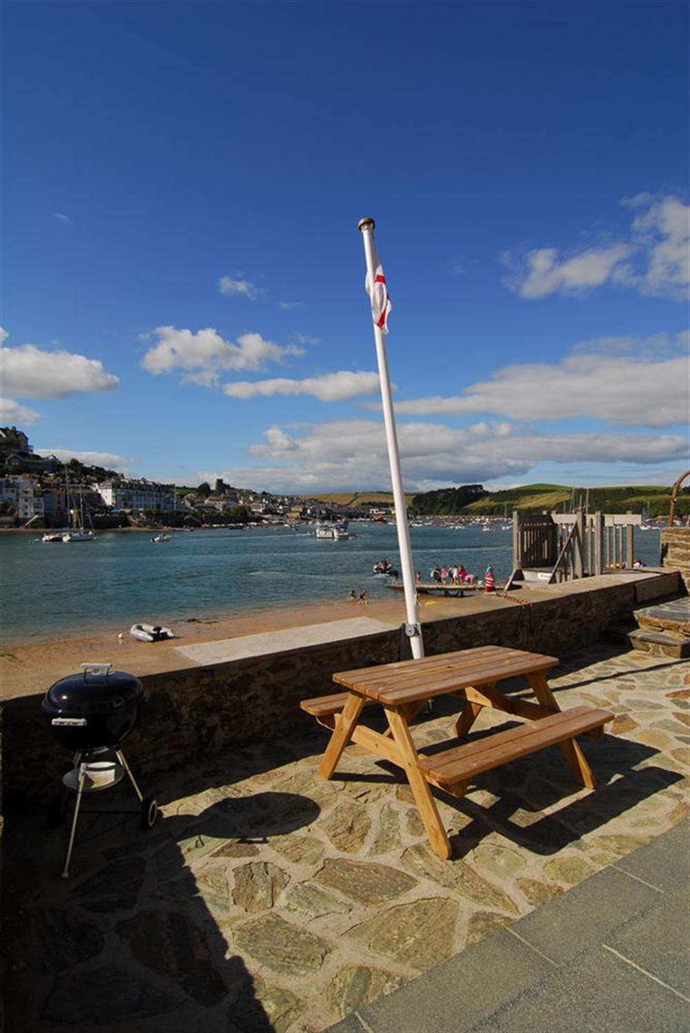 The terrace overlooks the harbour and enjoys the evening sun at Ferrycot in East Portlem'th, Salcombe
