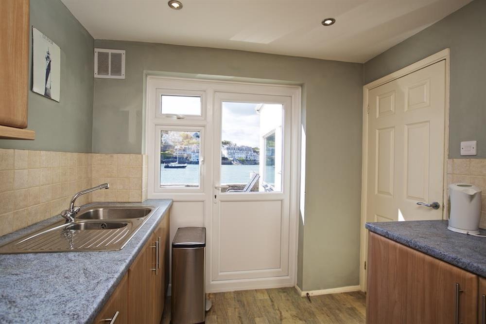 Kitchen with door out to terrace at Ferryside in East Portlemouth, Salcombe