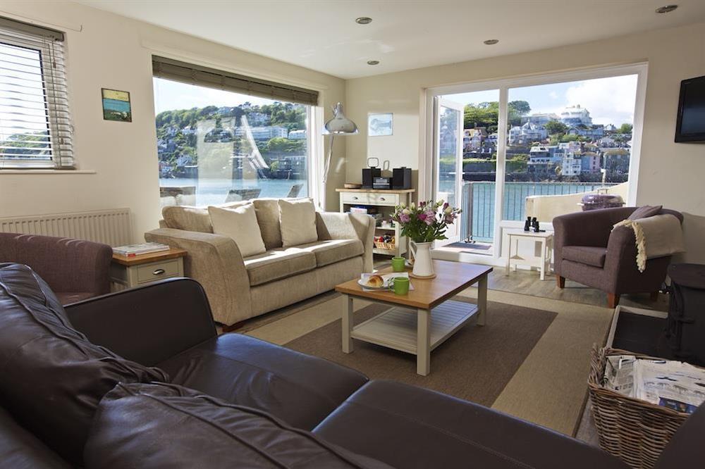 Spacious and sunny sitting room with door out to terrace at Ferryside in East Portlemouth, Salcombe
