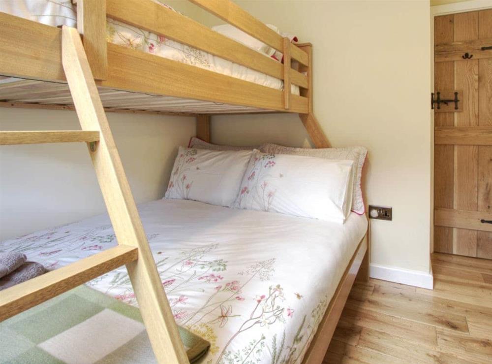 Relaxing bedroom with bunk bed that sleeps 3 (photo 2) at Fferam Gorniog in Mountain, near Holyhead, Gwynedd