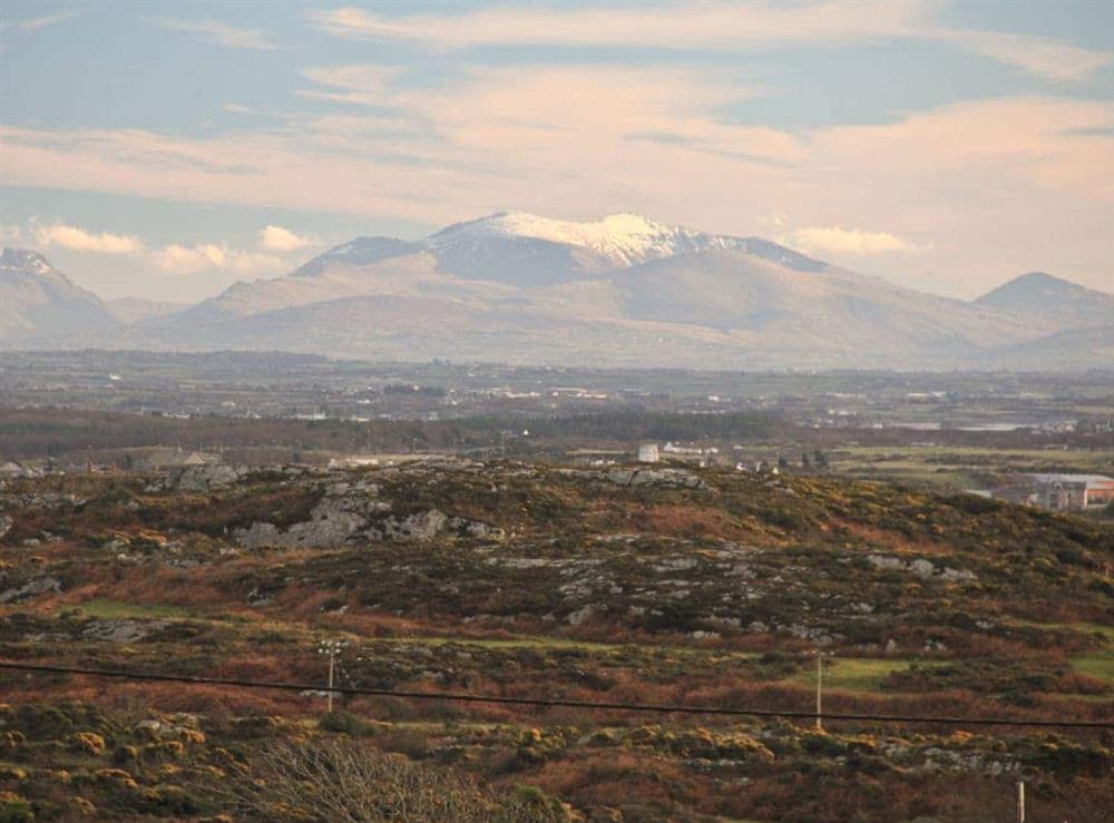 View of Snowdonia from Fferam Gorniog at Fferam Gorniog in Mountain, near Holyhead, Gwynedd
