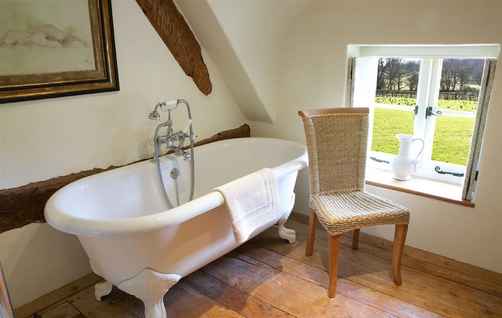 First floor, roll top bath with a view at Field Cottage and Garden Room, Elmley Castle, Pershore