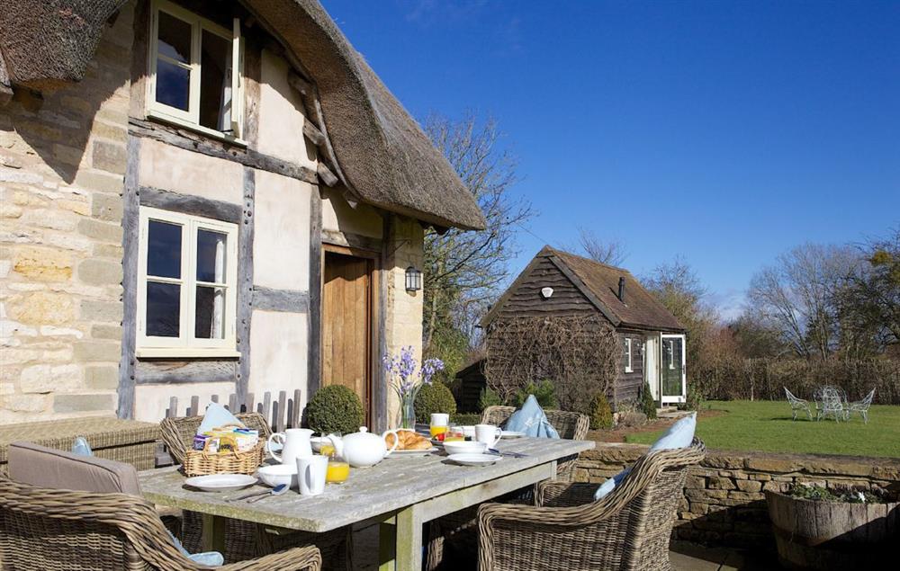 Terrace and garden furniture looking out to the stunning views at Field Cottage, Elmley Castle