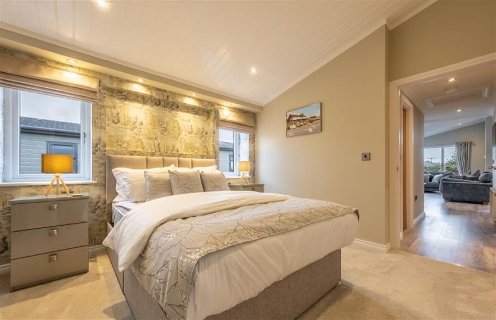 Ground floor: Master bedroom with king-size bed at Field Lodge, Burnham Market near Kings Lynn