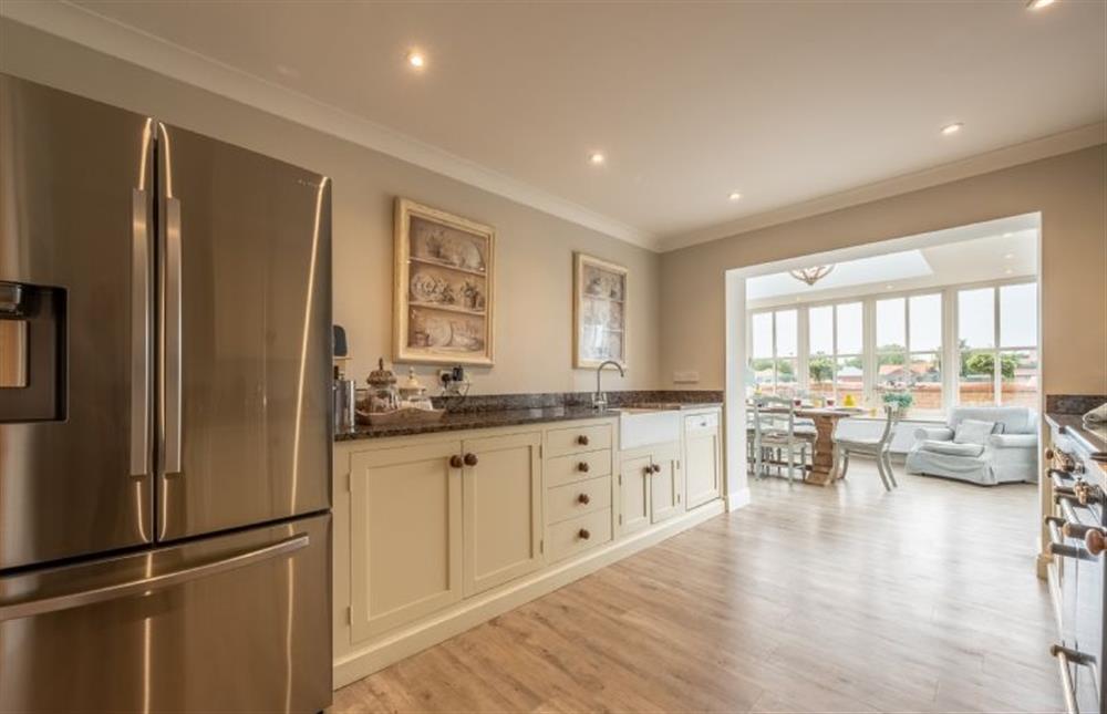 The well-equipped kitchen boasts a large fridge and freezer at Field Piece Cottage, Burnham Market