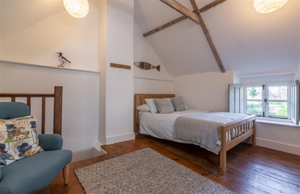 First floor: Bedroom two has a double bed at Field Row, Field Dalling near Holt