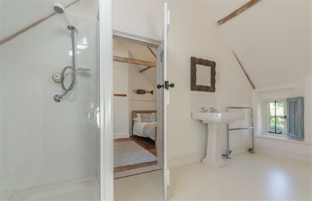 First floor: The Jack-and-Jill bathroom has bath and separate shower (photo 2) at Field Row, Field Dalling near Holt