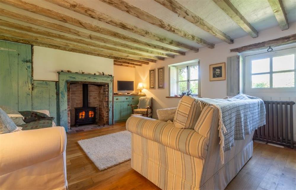 Ground floor: The snug has a cosy wood burning stove at Field Row, Field Dalling near Holt