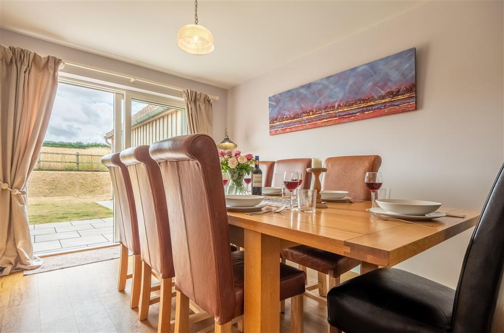 Dining area with a beautiful view of the garden at Field View, Sedgeford
