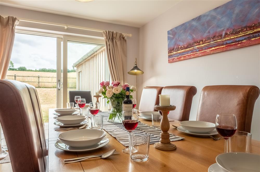 Dining table with seating for eight guests at Field View, Sedgeford