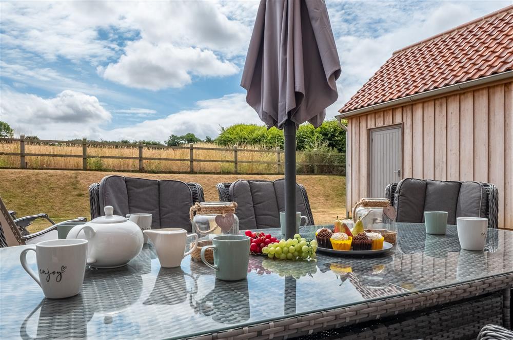 Enjoy al-fresco dining with stunning views of the surrounding countryside at Field View, Sedgeford