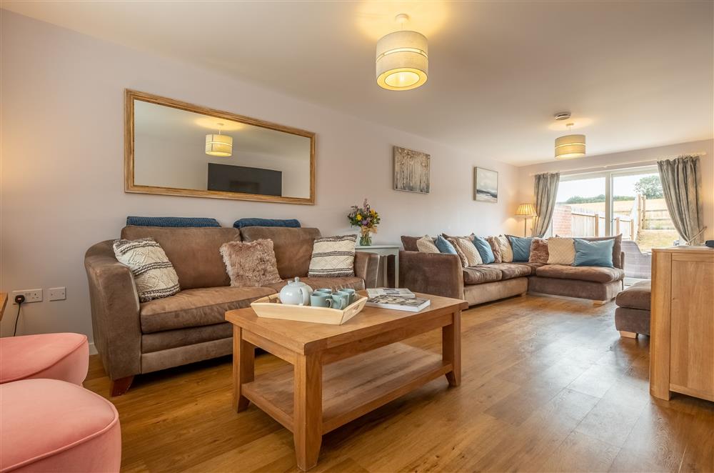 Relax in the sitting room with comfortable seating throughout at Field View, Sedgeford