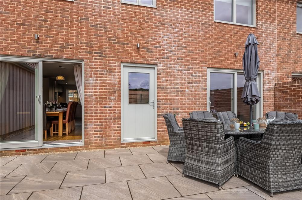 South facing garden with patio and garden furniture at Field View, Sedgeford
