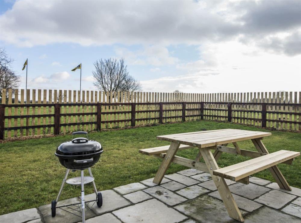 Relaxing enclosed garden with patio at Field View in Wainfleet St. Mary, near Skegness, Lincolnshire