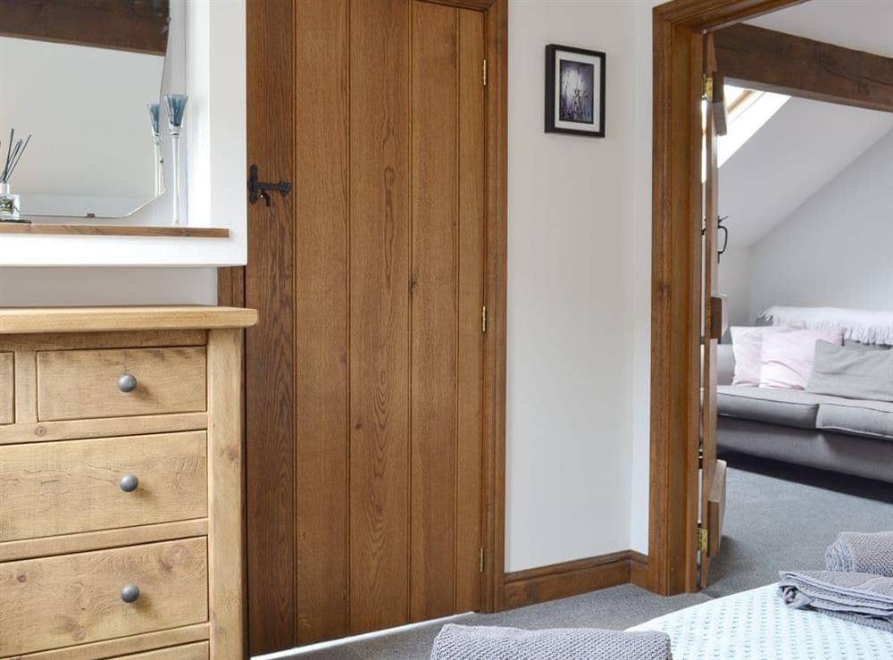 Peaceful double bedroom adjoins the living area at Fields Farm Apartment in Peak Forest, near Buxton, Derbyshire