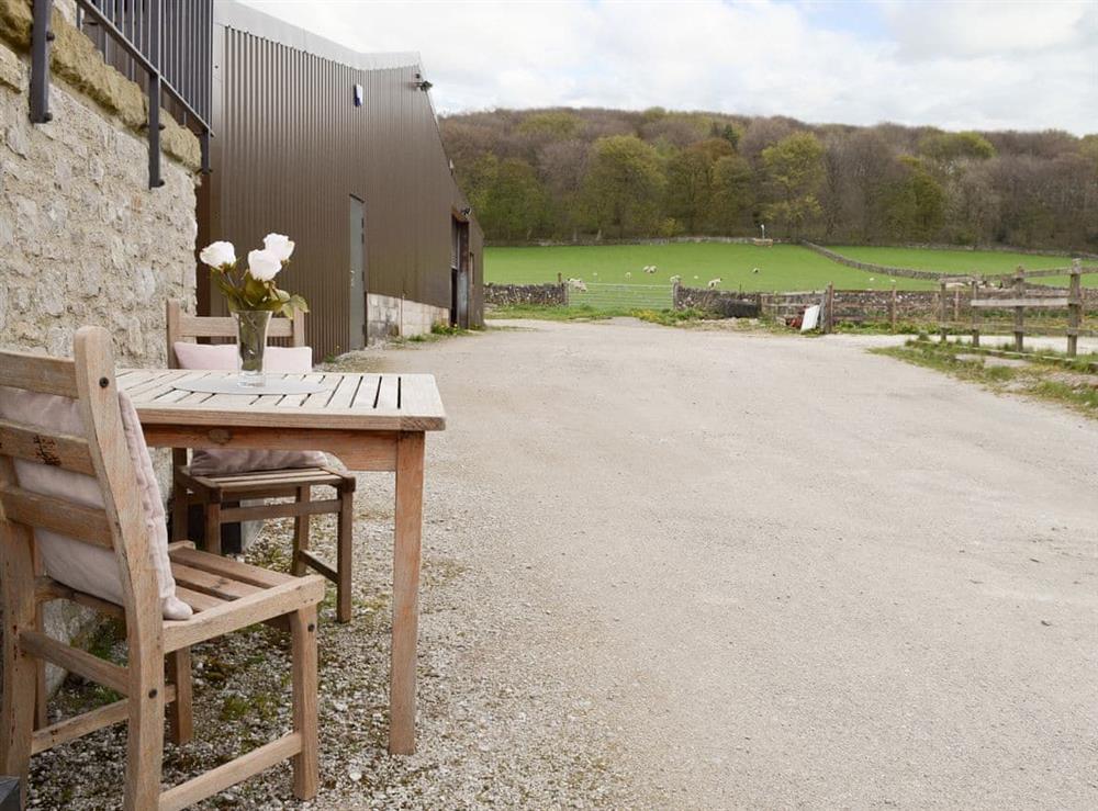 Sitting out area with rural views at Fields Farm Apartment in Peak Forest, near Buxton, Derbyshire