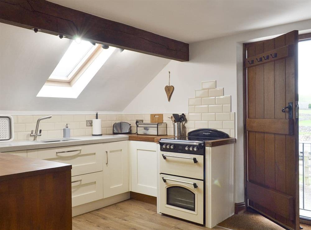 Well-equipped fitted kitchen area at Fields Farm Apartment in Peak Forest, near Buxton, Derbyshire