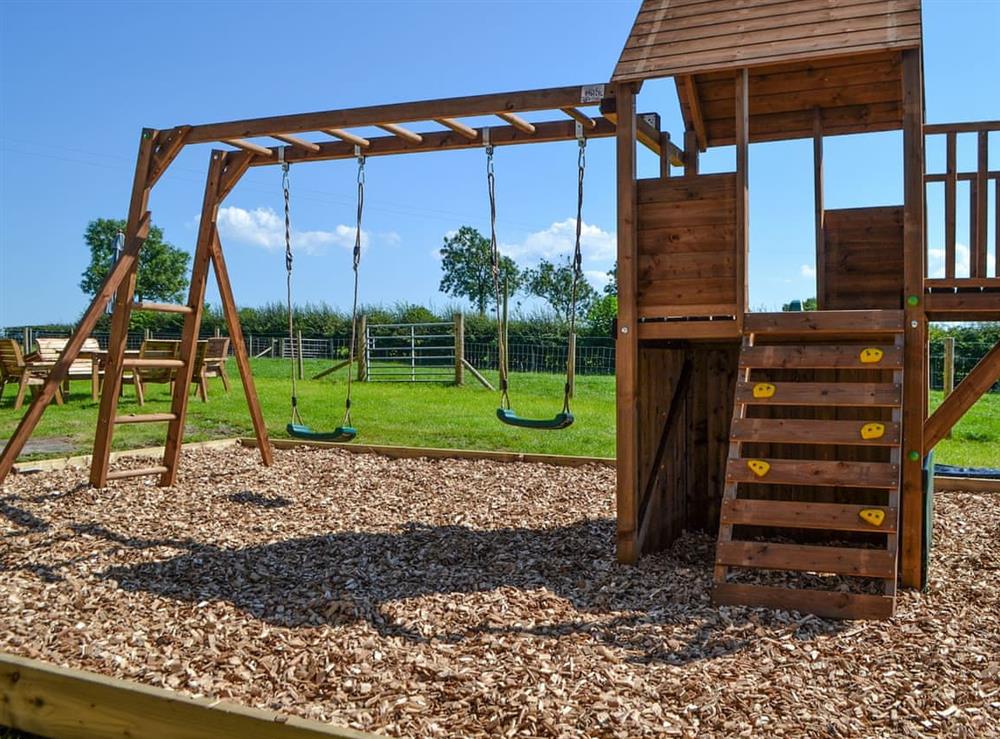 Children’s play area at Fieldside Farmhouse in Dovenby, Cockermouth, Cumbria