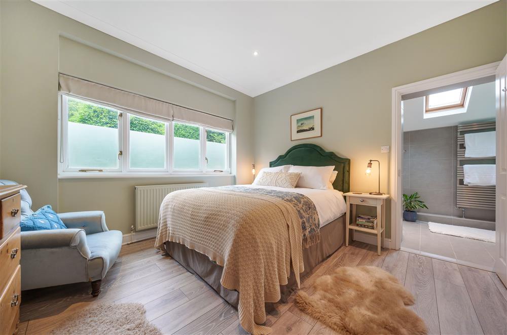 Bedroom one with a 4’6 double bed and en-suite at Fig and Bay Cottage, Axminster