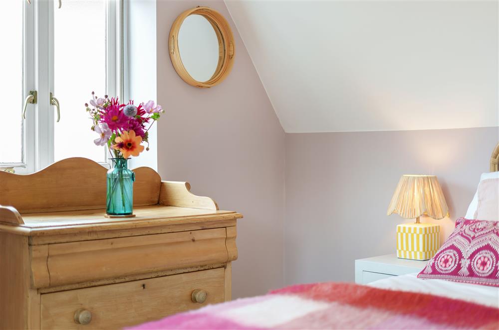 Bedroom three with its pretty styling at Fig and Bay Cottage, Axminster