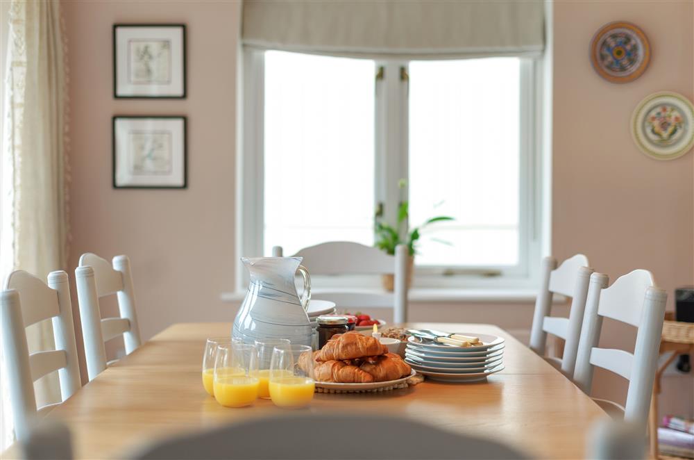Enjoy eating together at the dining table at Fig and Bay Cottage, Axminster