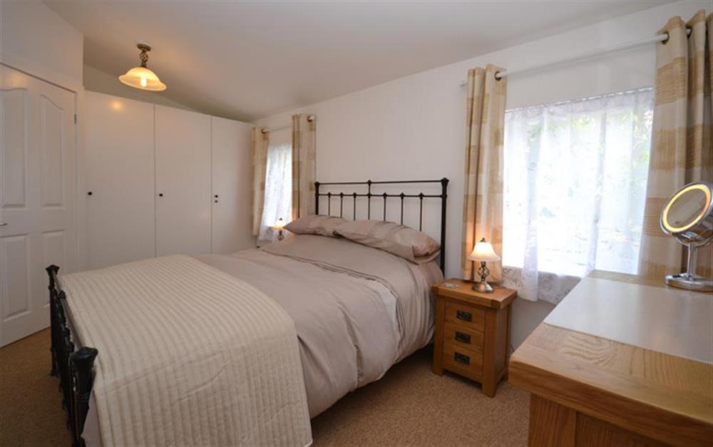 Door from lounge on to the double bedroom at Figtree Cottage in Milford On Sea