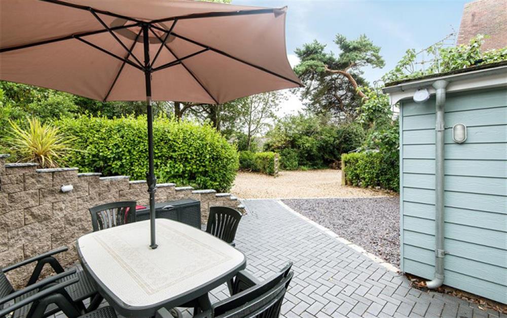 Patio area perfect for al fresco dining  at Figtree Cottage in Milford On Sea