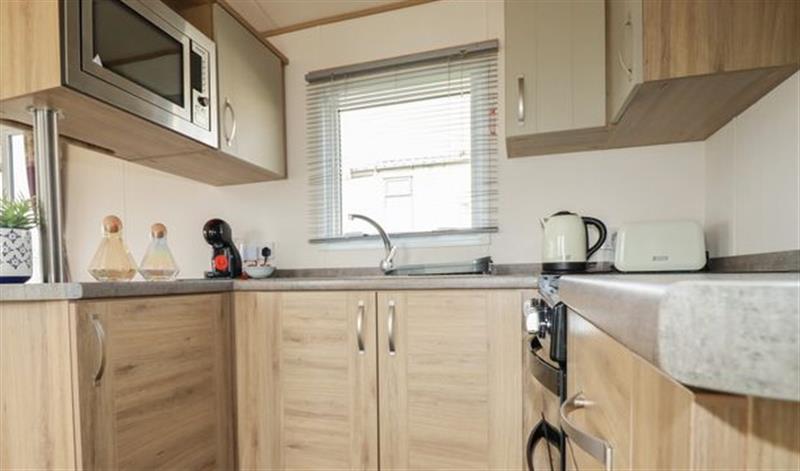 This is the kitchen at Finch 25 - Meadow Lakes Holiday Park, Hewas Water near Polgooth