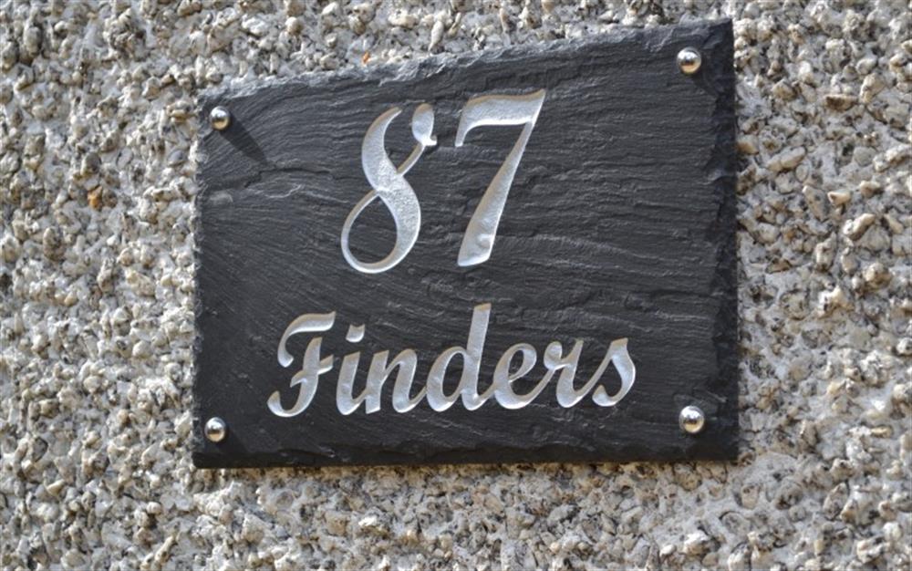 The nameplate is prominently placed  at Finders, 87 Keeper's Cottage in Maenporth